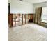 Unfinished bedroom with exposed bathroom framing at 4424 Floramar Ter, New Port Richey, FL 34652