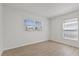 Bright bedroom with light flooring and large windows at 4424 Floramar Ter, New Port Richey, FL 34652