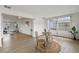Light and airy dining area with a view into the living room at 4424 Floramar Ter, New Port Richey, FL 34652