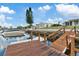 Private dock with wooden walkway offers convenient boat access at 4424 Floramar Ter, New Port Richey, FL 34652