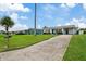 One story home with driveway and green lawn at 4424 Floramar Ter, New Port Richey, FL 34652