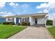 White one story home with blue door and carport at 4424 Floramar Ter, New Port Richey, FL 34652