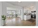 Bright kitchen features stainless steel appliances and light wood laminate flooring at 4424 Floramar Ter, New Port Richey, FL 34652