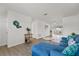 Open concept living room with blue sectional sofa and wood floors at 4424 Floramar Ter, New Port Richey, FL 34652