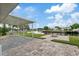 Spacious patio with fire pit and seating area, overlooking the water at 4424 Floramar Ter, New Port Richey, FL 34652