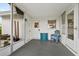 Covered porch with seating and access to the backyard at 4424 Floramar Ter, New Port Richey, FL 34652
