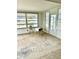 Bright sunroom with water views and wood-look flooring at 4424 Floramar Ter, New Port Richey, FL 34652