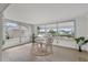 Sunroom with water views and light wood flooring at 4424 Floramar Ter, New Port Richey, FL 34652