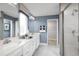 Elegant bathroom with double vanity and walk-in shower at 4515 Spire Run, Lakewood Ranch, FL 34211