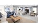Open kitchen with white cabinets, island, stainless steel appliances, and breakfast area at 4515 Spire Run, Lakewood Ranch, FL 34211