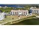 Aerial view of waterfront condo building with parking and private beach access at 4620 Bay Blvd # 1145, Port Richey, FL 34668
