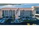 Aerial view of waterfront condo building with parking and landscaping at 4620 Bay Blvd # 1145, Port Richey, FL 34668