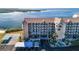 Aerial view of condo building showcasing waterfront location and parking at 4620 Bay Blvd # 1145, Port Richey, FL 34668