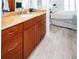 Bathroom with granite countertop, wood cabinets, and updated sink at 4620 Bay Blvd # 1145, Port Richey, FL 34668