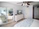 Bright bedroom with water view, sliding door to balcony, and large dresser at 4620 Bay Blvd # 1145, Port Richey, FL 34668