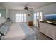 Main bedroom with king bed and stunning water views at 4620 Bay Blvd # 1145, Port Richey, FL 34668