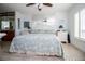 Main bedroom with king-size bed, light blue bedding, and hardwood floors at 4620 Bay Blvd # 1145, Port Richey, FL 34668