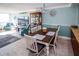 Dining area with table and chairs, adjacent to living room at 4620 Bay Blvd # 1145, Port Richey, FL 34668