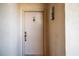 Condo entry door with brass door knocker and address number 1145 at 4620 Bay Blvd # 1145, Port Richey, FL 34668