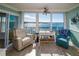 Living room with water views, comfortable seating, and hardwood floors at 4620 Bay Blvd # 1145, Port Richey, FL 34668
