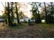 Private backyard with mature trees offering shade and privacy at 4852 Capron St, New Port Richey, FL 34653