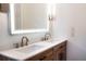 Modern bathroom with double vanity, quartz countertop, and LED lit mirror at 4852 Capron St, New Port Richey, FL 34653
