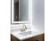 Bathroom with a lighted vanity mirror and modern faucet at 4852 Capron St, New Port Richey, FL 34653