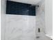 Modern bathroom with blue and white marble tile and a rainfall shower head at 4852 Capron St, New Port Richey, FL 34653