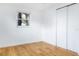 Simple bedroom with wood floors and window at 4852 Capron St, New Port Richey, FL 34653