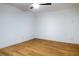 Simple bedroom with light wood floors and a ceiling fan at 4852 Capron St, New Port Richey, FL 34653