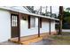 Inviting front porch with wooden flooring and stylish light fixture at 4852 Capron St, New Port Richey, FL 34653