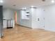 White kitchen cabinets, granite countertops and stainless steel dishwasher at 4852 Capron St, New Port Richey, FL 34653