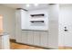 White kitchen cabinets and granite countertops at 4852 Capron St, New Port Richey, FL 34653