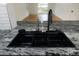 Modern kitchen sink and granite countertop at 4852 Capron St, New Port Richey, FL 34653