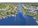 Aerial view showing waterfront property with boat slips and canal access at 4907 Floramar Ter, New Port Richey, FL 34652