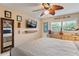 Main bedroom with a large bed, dresser and mirror at 4907 Floramar Ter, New Port Richey, FL 34652