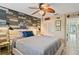 Guest bedroom with a queen-size bed and coastal decor at 4907 Floramar Ter, New Port Richey, FL 34652
