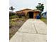 House with driveway and front yard landscaping at 4907 Floramar Ter, New Port Richey, FL 34652