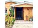 Front entrance with a decorative gate and potted plants at 4907 Floramar Ter, New Port Richey, FL 34652