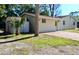 Rear view of house showing shed and driveway at 5641 Quist Dr, Port Richey, FL 34668