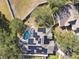 Aerial view showing home with solar panels, pool, and large backyard at 609 Salt Lake Dr, Tarpon Springs, FL 34689
