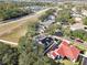 Aerial view showcasing a house with solar panels and a neighborhood at 609 Salt Lake Dr, Tarpon Springs, FL 34689