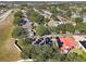 Aerial view showing home with solar panels and surrounding houses at 609 Salt Lake Dr, Tarpon Springs, FL 34689