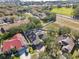 Aerial view of a community featuring several homes with solar panels at 609 Salt Lake Dr, Tarpon Springs, FL 34689