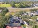 Aerial view of home with solar panels, pool, and surrounding houses at 609 Salt Lake Dr, Tarpon Springs, FL 34689
