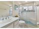 Updated bathroom with a shower/tub combo and white vanity at 609 Salt Lake Dr, Tarpon Springs, FL 34689