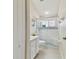 Clean bathroom with a walk-in shower, toilet and vanity at 609 Salt Lake Dr, Tarpon Springs, FL 34689