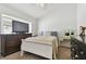 Cozy bedroom with a double bed, dresser, and TV at 609 Salt Lake Dr, Tarpon Springs, FL 34689