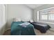 Guest bedroom with two twin beds and a window seat at 609 Salt Lake Dr, Tarpon Springs, FL 34689
