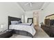 Spacious primary bedroom with ample natural light and en-suite bathroom access at 609 Salt Lake Dr, Tarpon Springs, FL 34689